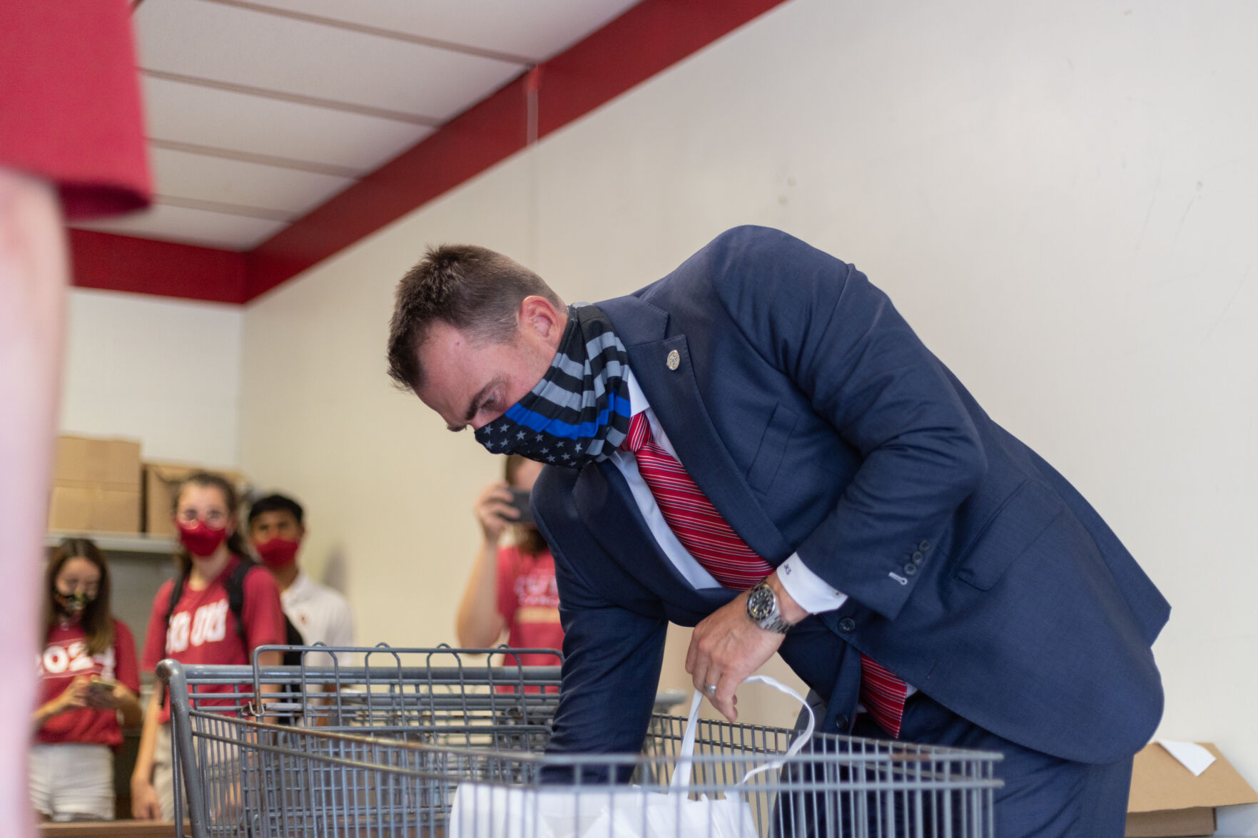 OU Food Pantry Worker and Oklahoma Governor Kevin Stitt